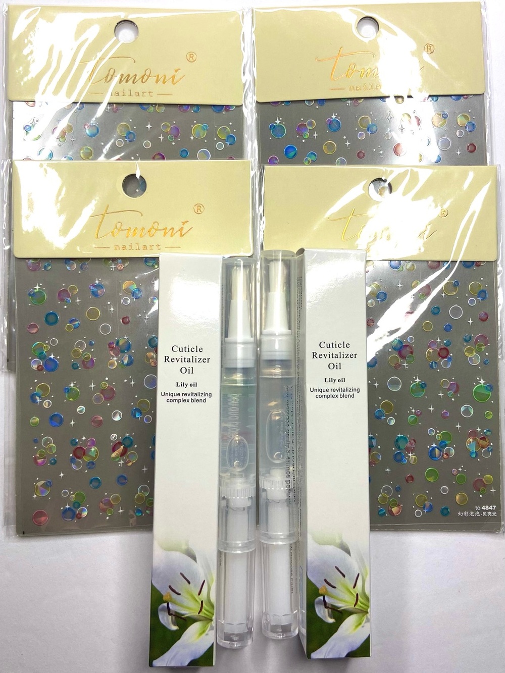 2 Nail cuticle oil and 4 nail stickers
